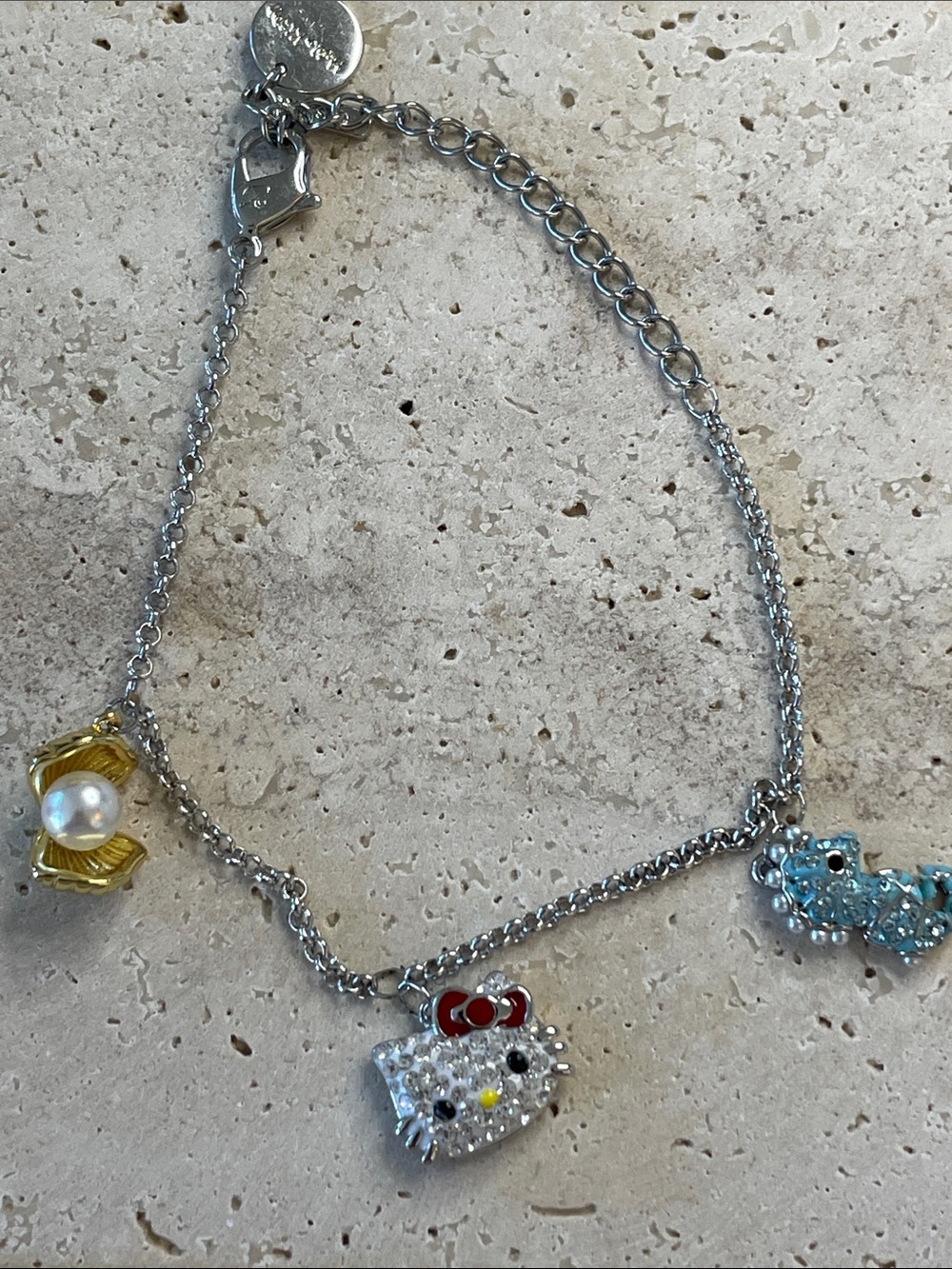 Hello Kitty Silver Necklace with Red Bow, Blue Charm & Gold Shell
